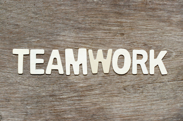 Alphabet letter in word teamwork on wood background - Φωτογραφία, εικόνα