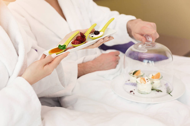 Young couple having breakfast in hotel room - Photo, Image