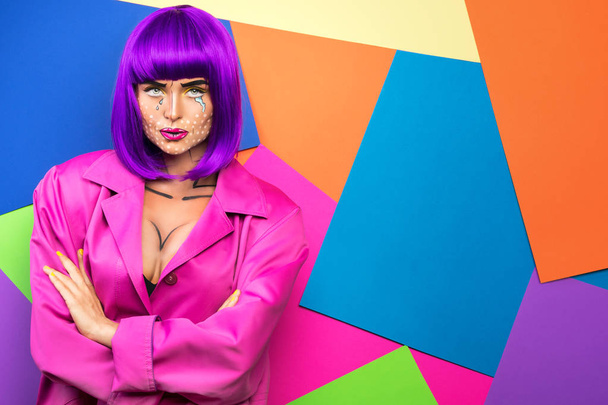 Young woman with pop art makeup against colorful background - Fotó, kép