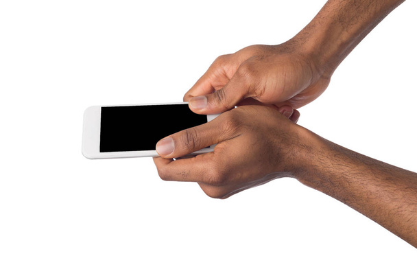 Ręka trzyma mobile smartphone rezygnować pusty ekran - Zdjęcie, obraz