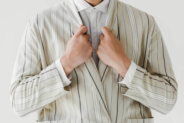 cropped shot of man in vintage striped jacket isolated on white - Fotó, kép
