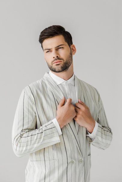 handsome young man in vintage striped jacket on white - Photo, Image