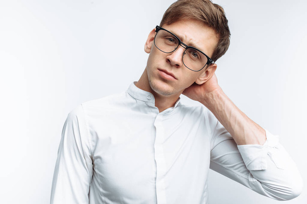 Portrait of young attractive guy in glasses, in white shirt, isolated on white background, - Foto, afbeelding