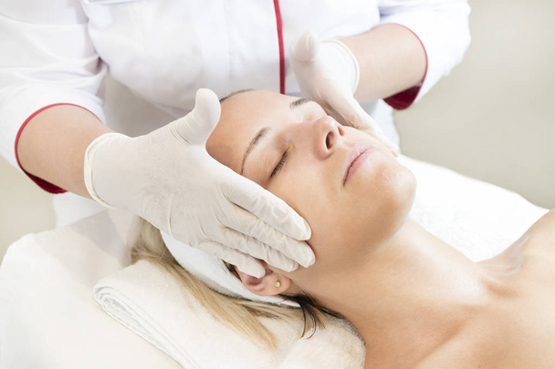 Process of massage and facials in beauty salon  - Fotó, kép