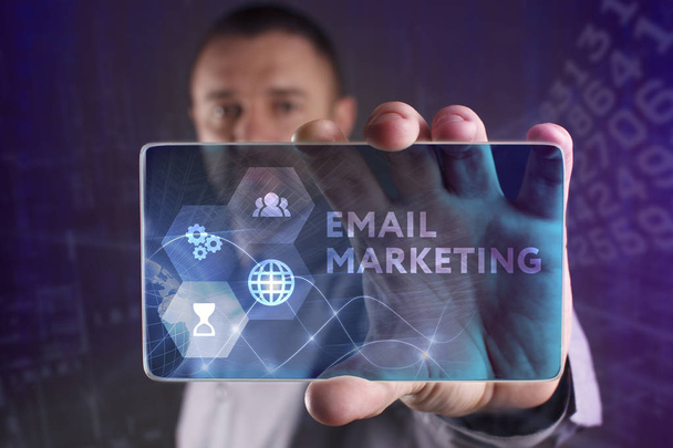 The concept of business, technology, the Internet and the network. A young entrepreneur working on a virtual screen of the future and sees the inscription: Email marketing - Photo, Image
