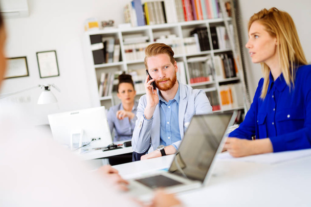 Business coworkers teamwork in modern white office - Foto, afbeelding