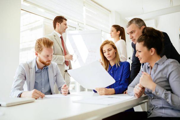 Successful business partners brainstorming in modern office - Zdjęcie, obraz