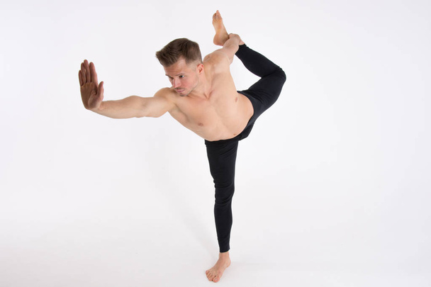 Young handsome man and yoga. Training and relaxation.  Healthy lifestyle - Photo, Image