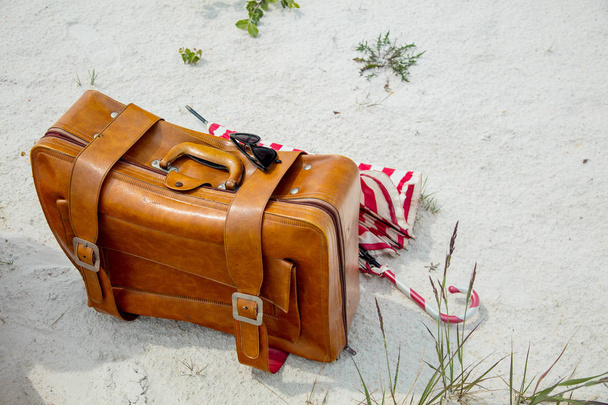 suitcase alone on sand in summer season - Photo, Image