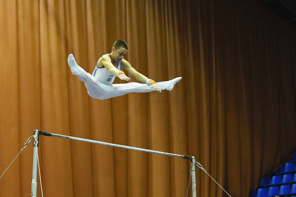 : Male gymnast performing during Stella Zakharova Artistic Gymnastics Ukraine international Cup - Photo, image