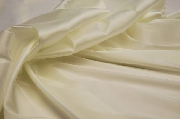 Lining fabric made of acetate and elastan in the color of ivory - Foto, afbeelding