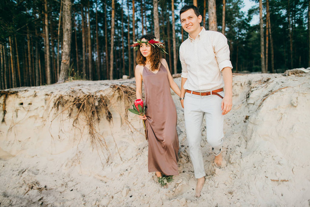 Happy beautiful young  couple in forest - Foto, Imagem