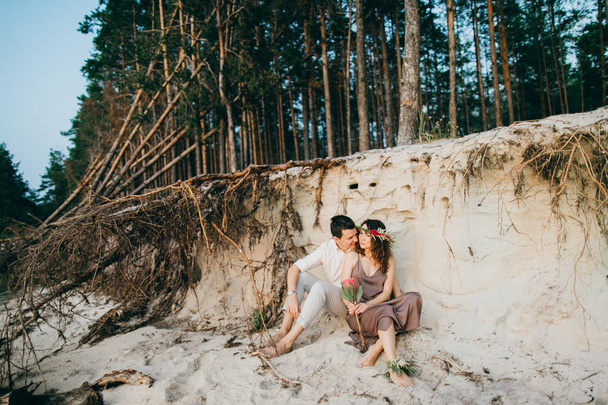 Happy beautiful young  couple in forest - Foto, imagen
