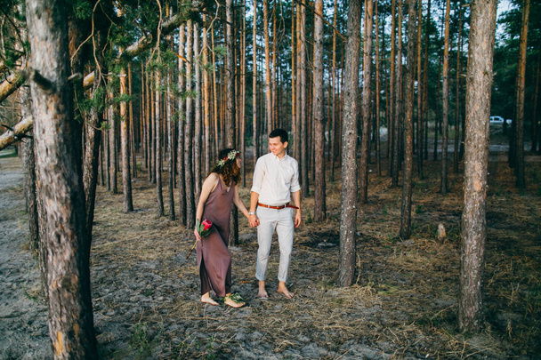 Happy beautiful young  couple in forest - Photo, Image