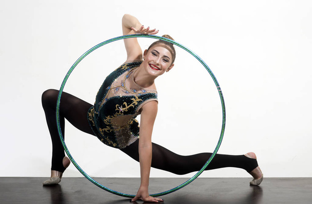 Workout sports activities in gym of flexible girl. Fitness and dieting of girl gymnast. Sport success and health. Woman with gymnastic ring. Woman train acrobatics with hula hoop in sportswear - Fotografie, Obrázek