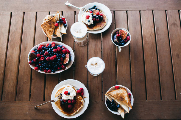 delicious  breakfast on wooden table in the morning  - Photo, Image