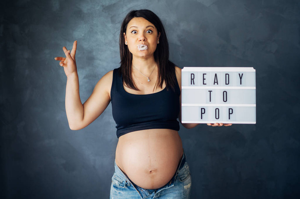beautiful baby future mother smiling with tummy in sight. pregnancy belly - 写真・画像