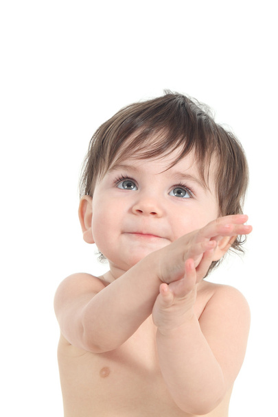 Baby watching above with her hands folded - Φωτογραφία, εικόνα