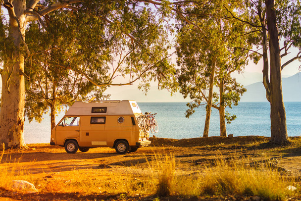 Tourism vacation and travel. Camper van on beach seashore in Greece - Zdjęcie, obraz