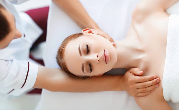 a beautiful girl enjoys massage and spa treatments - Photo, Image