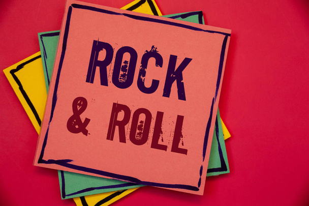 Words writing texts Rock Roll. Business concept for Musical Genre Type of popular dance music Heavy Beat SoundPink blue yellow papers ideas words concepts black letters red background - Photo, Image