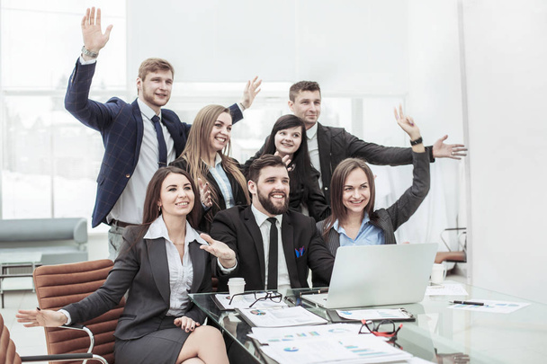 business team with their hands up and voting for decision-making near the desktop - 写真・画像