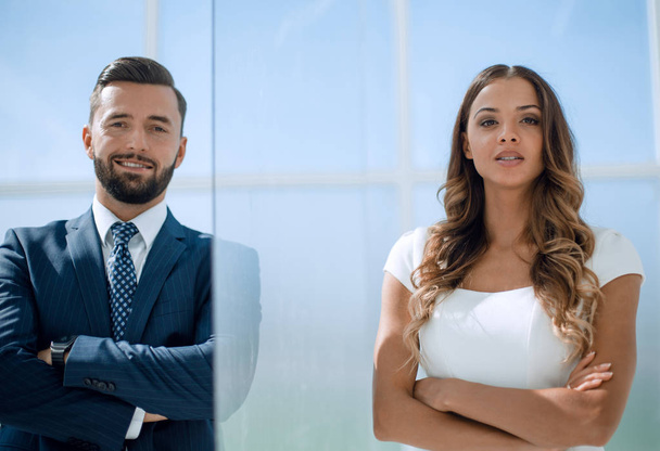 businessman and business woman on office window background - Foto, afbeelding