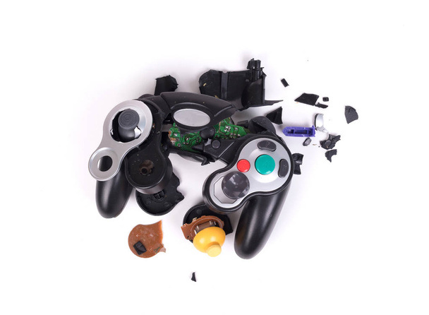 Broken video game controller on white background with clipping path - Photo, Image