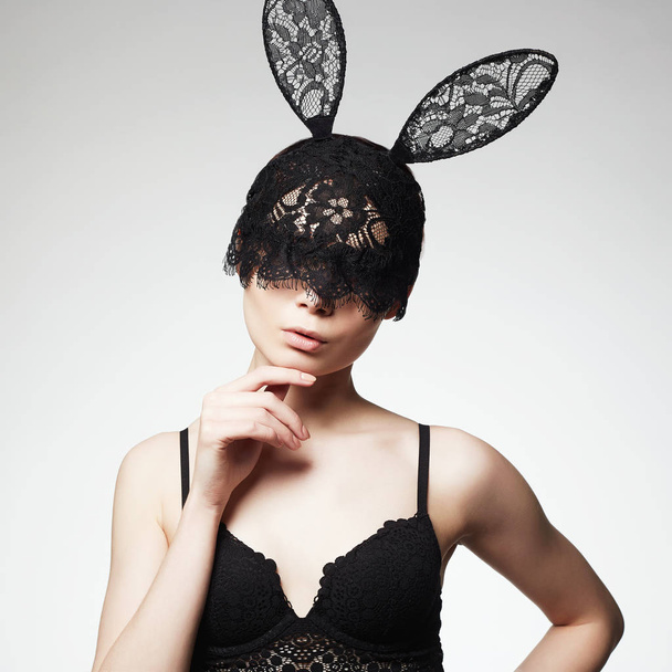 Beautiful Sexy Girl in Lace Mask. Young Woman in lingerie and funny Bunny Ears mask, Halloween masquerade - Фото, зображення