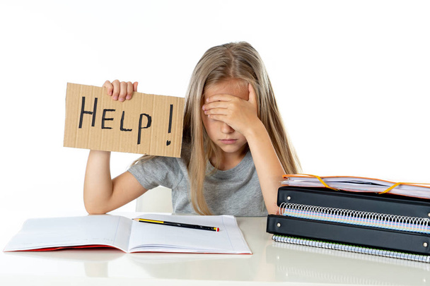 cute little school girl holding help sign in stress with books and homework. children education concept isolated on white background - Photo, Image