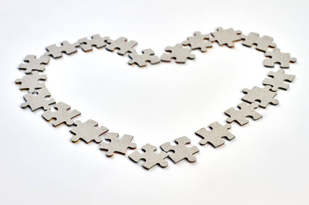 Shape of heart from puzzle elements. - Fotografie, Obrázek