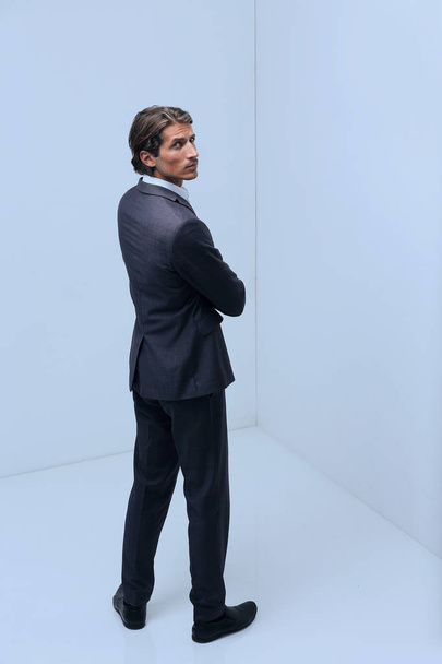 serious businessman standing in corner - Фото, изображение
