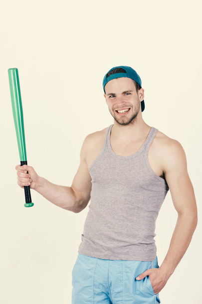 Man in cyan green cap on white background. Player with happy smiling face ready to play baseball - Fotó, kép