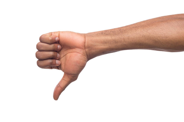 Thumb down of black man hand isolated on white background - Valokuva, kuva