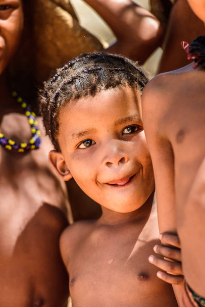 EAST OF WINDHOEK, NAMIBIA - JAN 3, 2016: Unidentified bushman boy. Bushman people are members of various indigenous hunter-gatherer people of Southern Africa - Photo, image