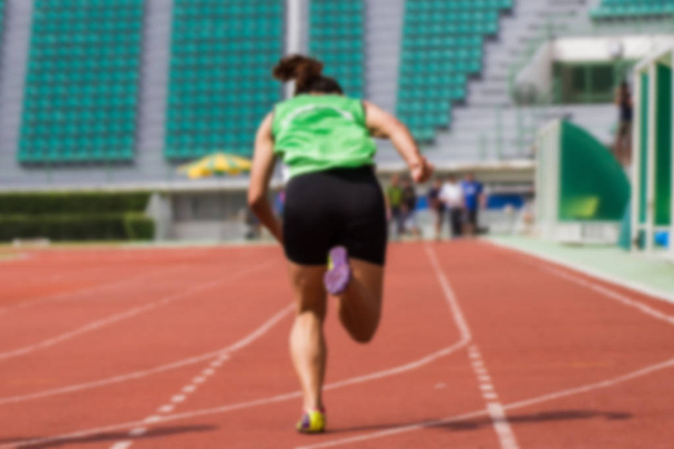 Blurred image - Athletes to practice running in the at Bangkok Thailand Stadium. - Foto, Bild