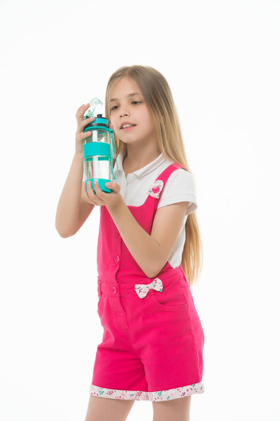 Girl hold water bottle isolated on white. Little child with plastic bottle. Only clean and fresh water. Thirst and health. Childhood. Stay hydrated and healthy. Drinking water for health - Фото, зображення