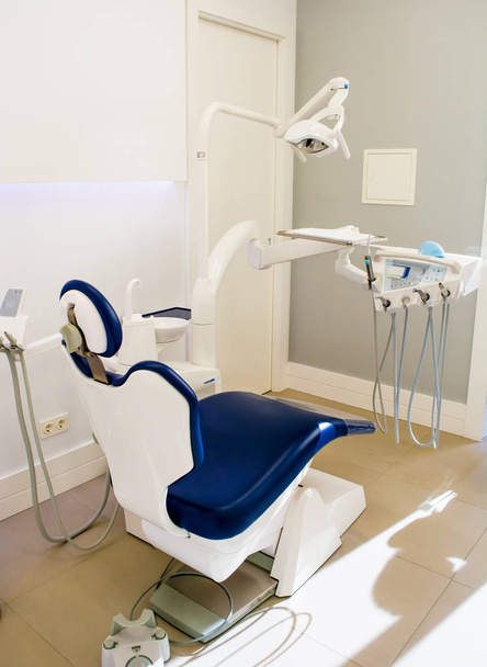 Modern dental practice. Dental chair and other accessories used by dentists - Photo, Image