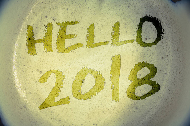 Writing note showing  Hello 2018. Business photo showcasing Starting a new year Motivational message 2017 is over nowIdeas messages concepts words letters created foamy coffee background - Φωτογραφία, εικόνα