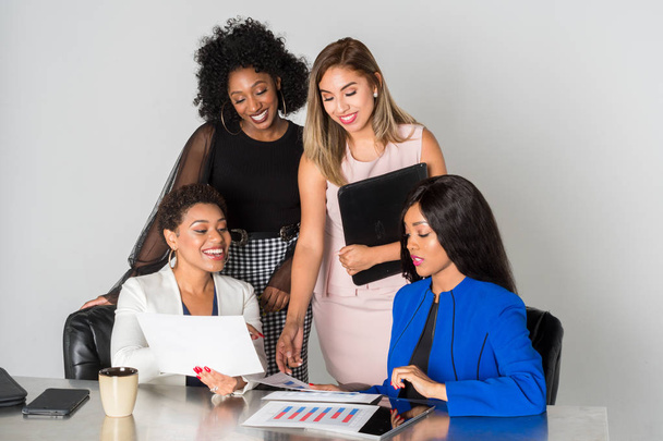 Group of businesswomen working together in an office - Foto, immagini