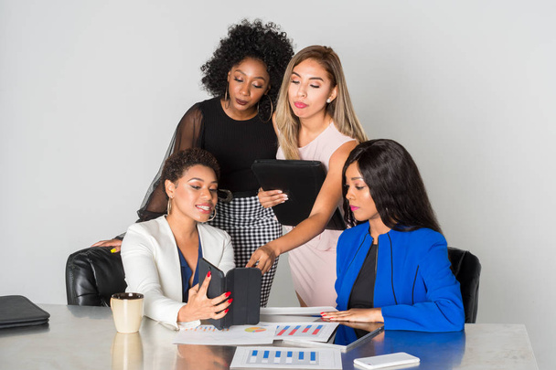 Group of businesswomen working together in an office - Foto, imagen