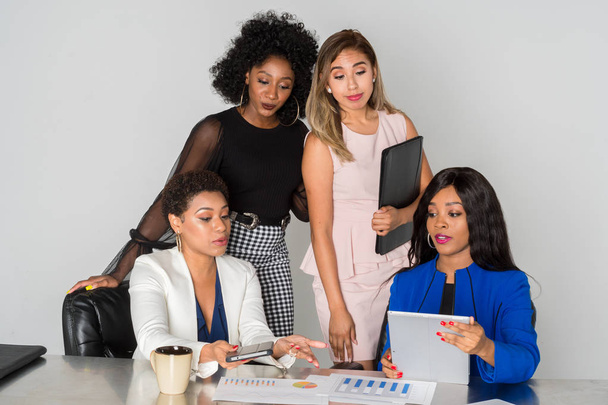Group of businesswomen working together in an office - Фото, изображение