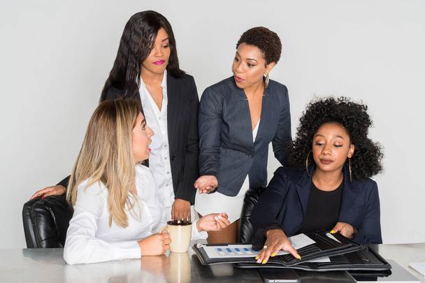 Group of businesswomen working together in an office - Fotó, kép