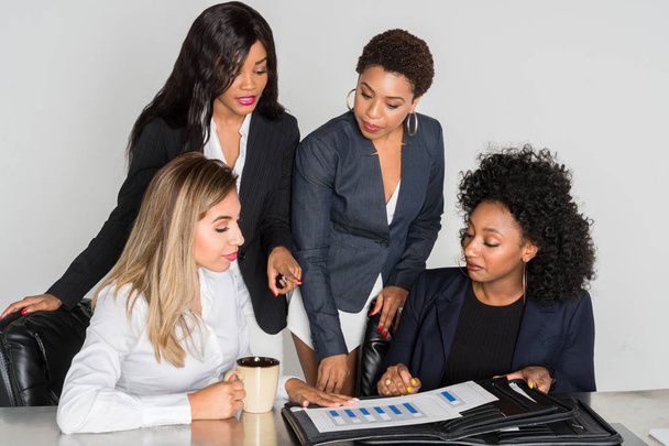 Group of businesswomen working together in an office - Foto, immagini