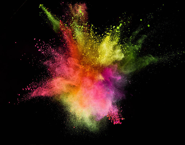 Colored powder explosion isolated on black background. - 写真・画像