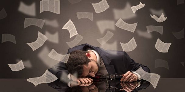 Businessman fell asleep at the office with paperwork concept - Foto, Bild