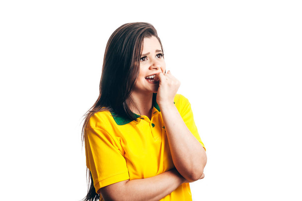 Nervous football fan in yellow on white background - Фото, изображение