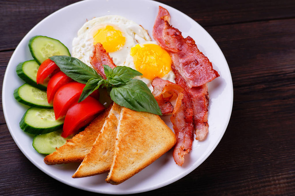 European breakfast- fried eggs with bacon - Photo, Image