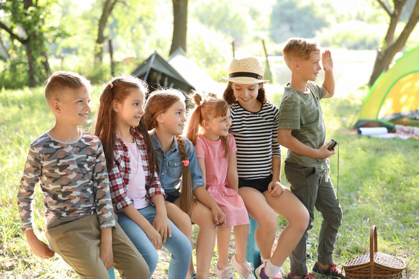 Little children outdoors on sunny day. Summer camp - Fotoğraf, Görsel