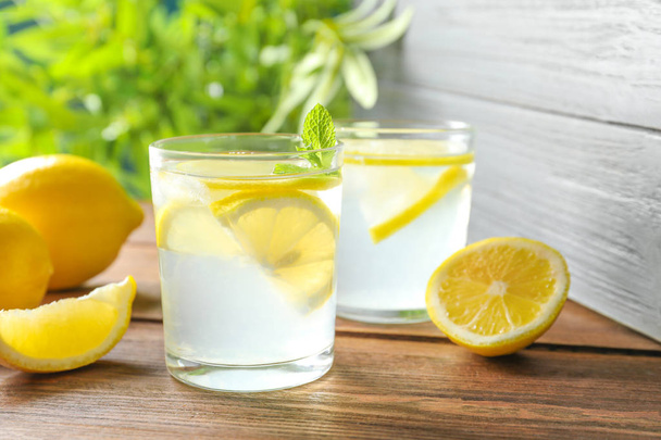 Natural lemonade with mint in glasses on wooden table - Foto, Imagem